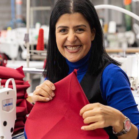 smiling female employee from Resilience, a social enterprise in France.